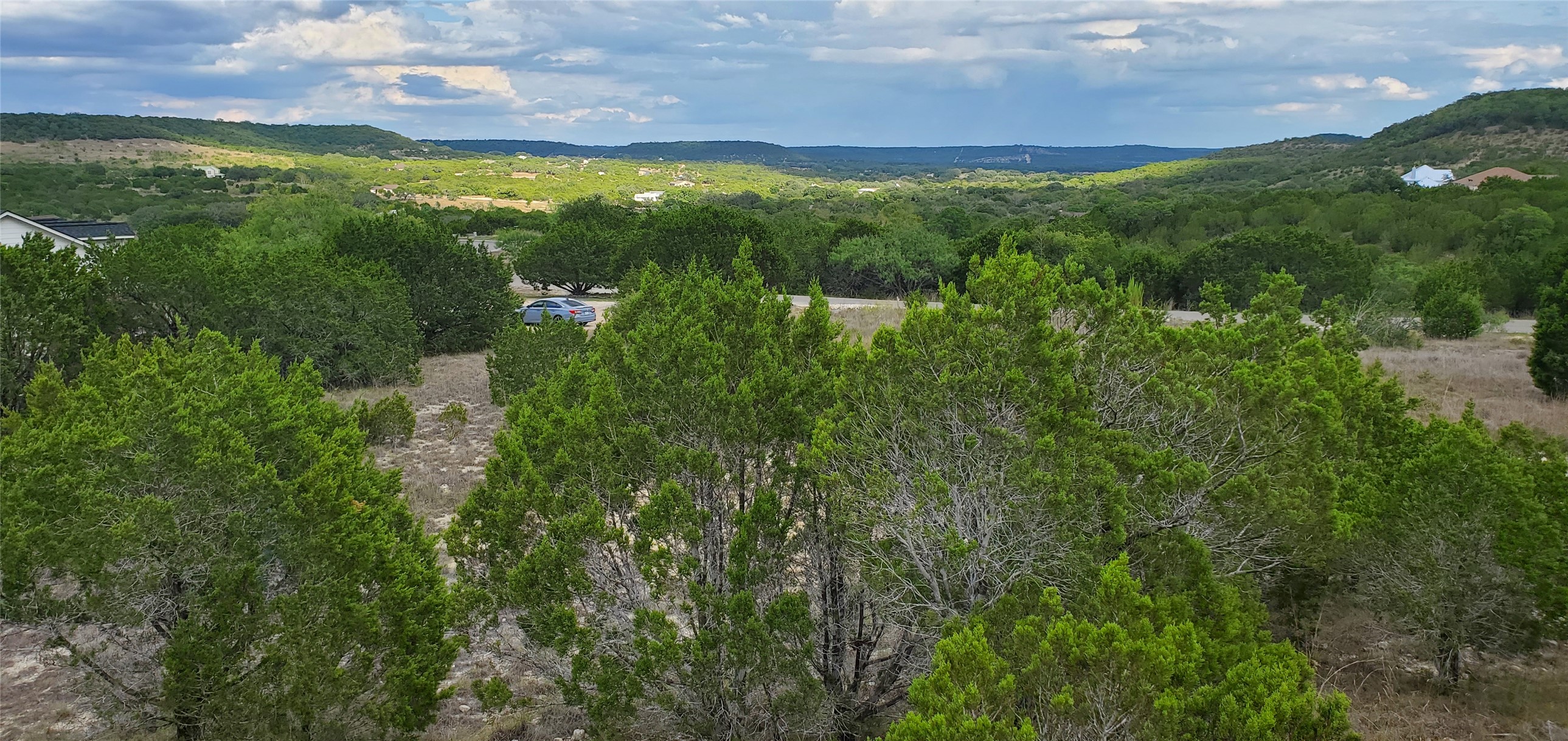 588 Balcones Ridge Way Bertram, TX 78605 - Photo 3 of 16 Bird's eye view of the lot area and a hilly backdrop
