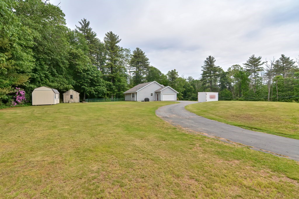 5 Salmon Brook Road Brookfield, MA 01506 - Photo 11 of 37 a view of a swimming pool with an outdoor space and seating area