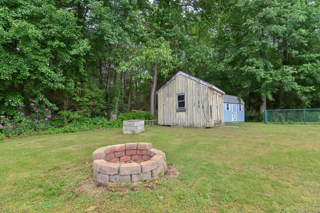 5 Salmon Brook Road Brookfield, MA 01506 - Photo 13 of 37 a view of a backyard with a garden and deck