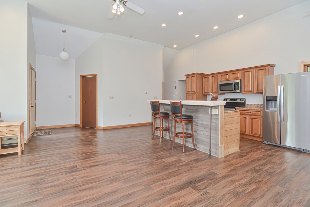5 Salmon Brook Road Brookfield, MA 01506 - Photo 19 of 37 a kitchen with stainless steel appliances a refrigerator and a stove top oven