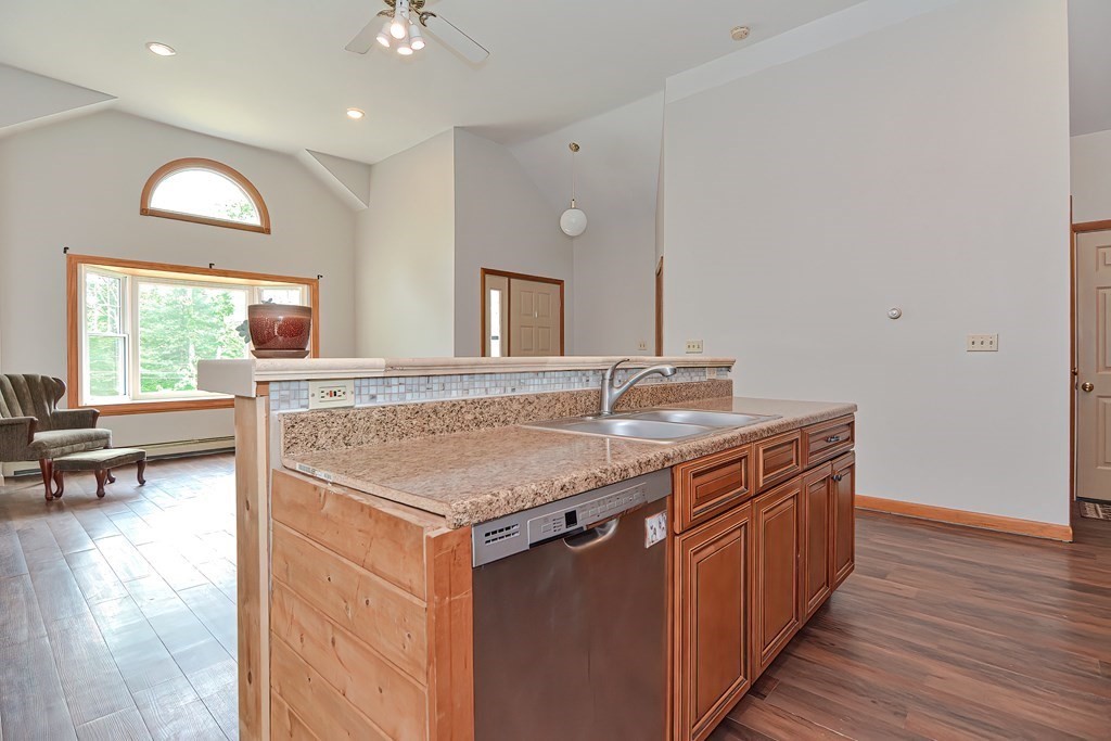 5 Salmon Brook Road Brookfield, MA 01506 - Photo 20 of 37 a bathroom with a granite countertop sink a large mirror and a wooden floor