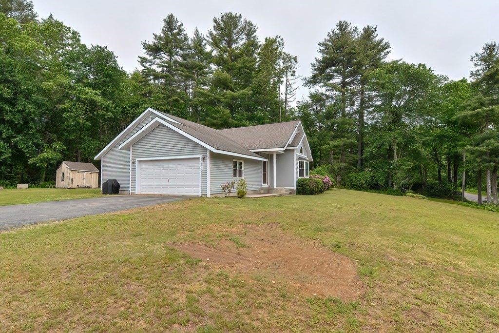 5 Salmon Brook Road Brookfield, MA 01506 - Photo 3 of 37 a white house with a small yard and large trees