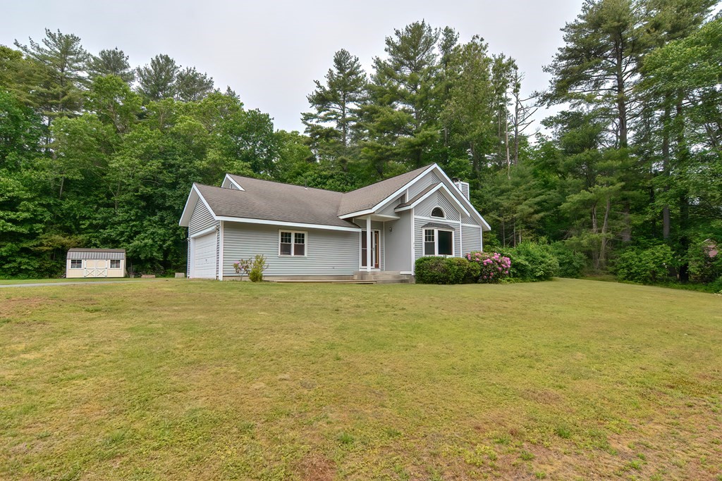 5 Salmon Brook Road Brookfield, MA 01506 - Photo 6 of 37 a front view of a house with a yard