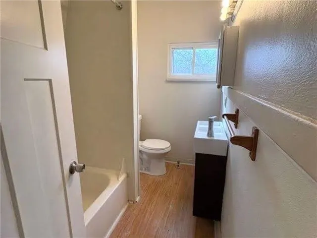 a bathroom with a bathtub and sink