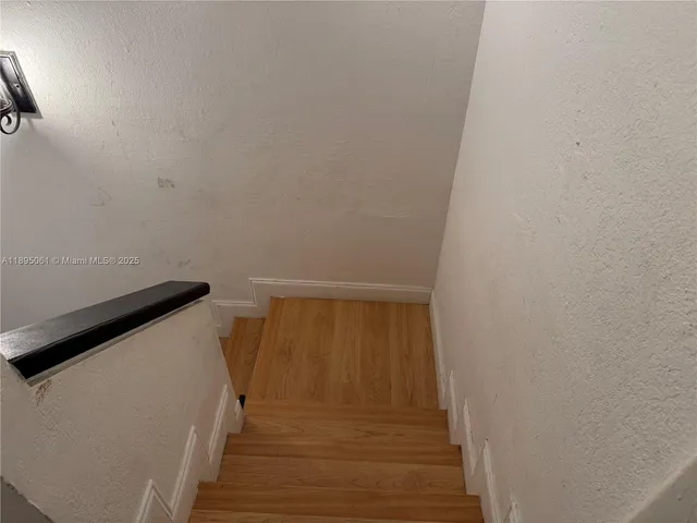 a bedroom with a bed and a dresser in it