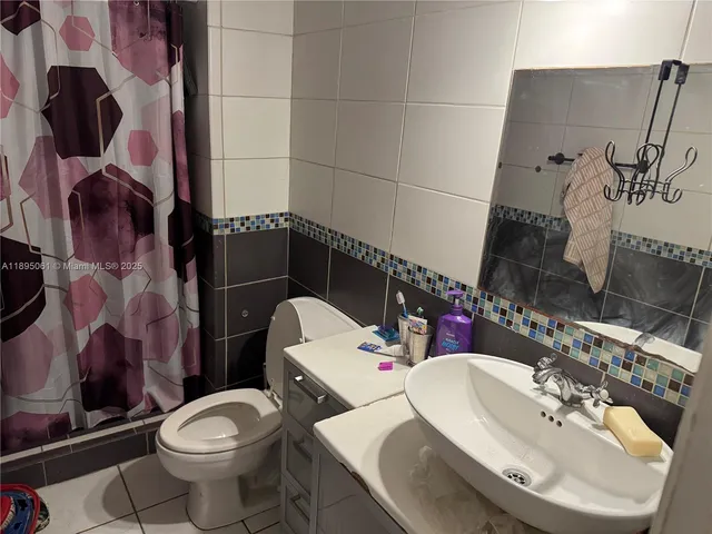 a bathroom with sink and mirror