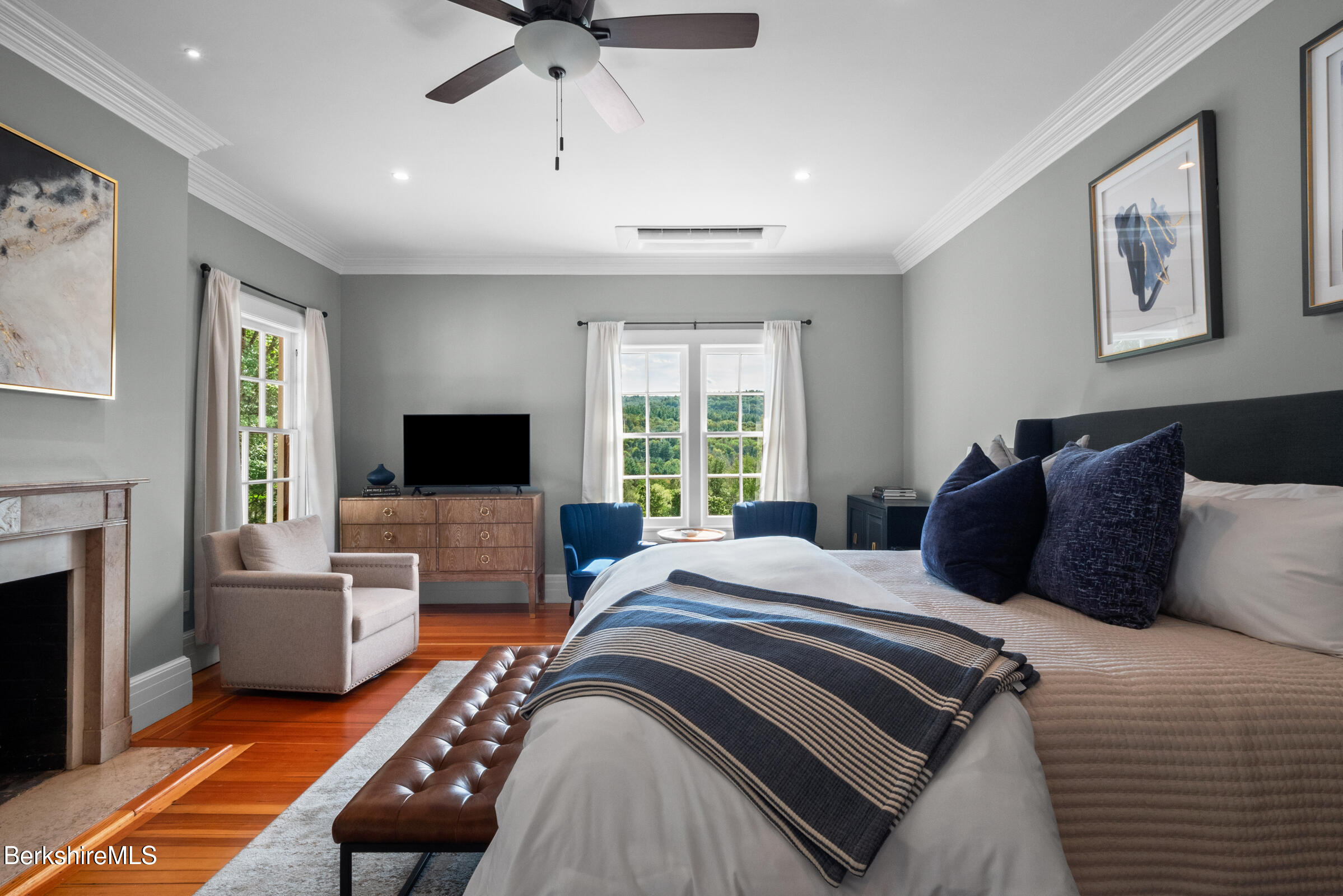 8 Webster Road Tyringham, MA 01264 - Photo 25 of 52 a bedroom with a large bed and a flat screen tv