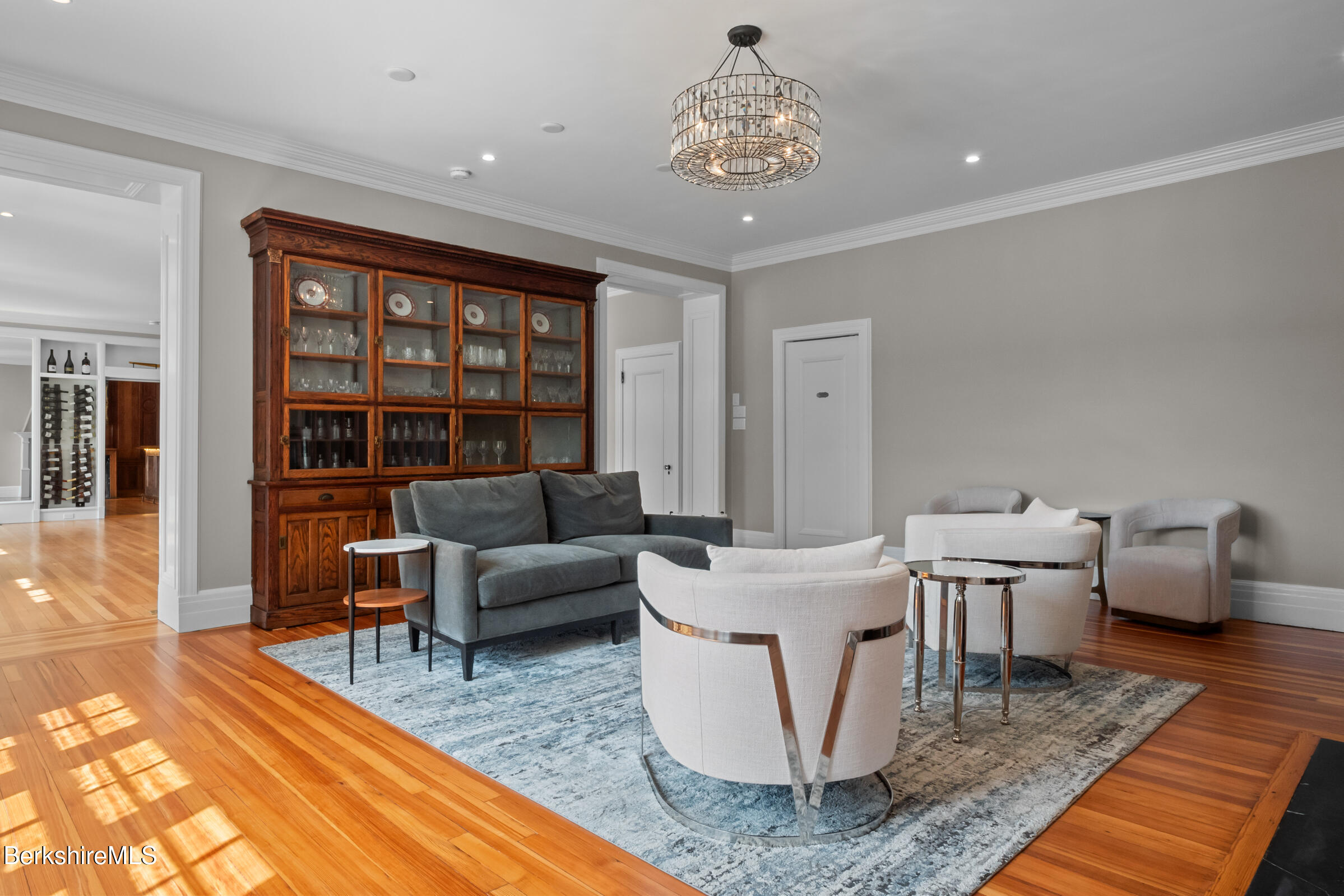 8 Webster Road Tyringham, MA 01264 - Photo 31 of 52 a living room with furniture and a chandelier