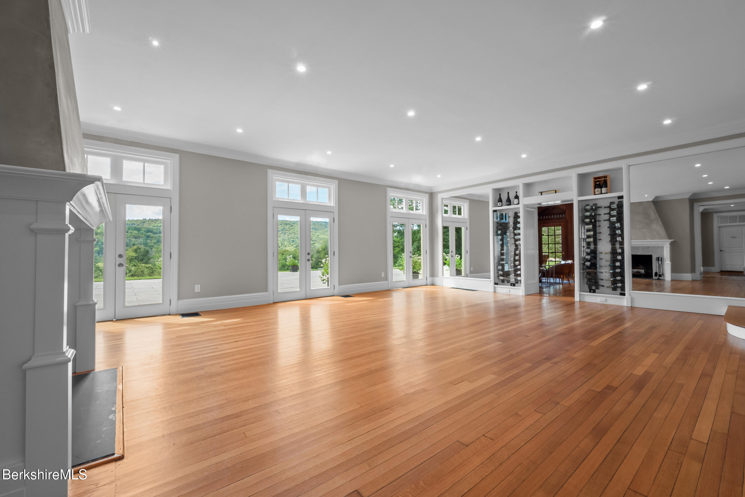 8 Webster Road Tyringham, MA 01264 - Photo 35 of 52 a view of an empty room with wooden floor and a window