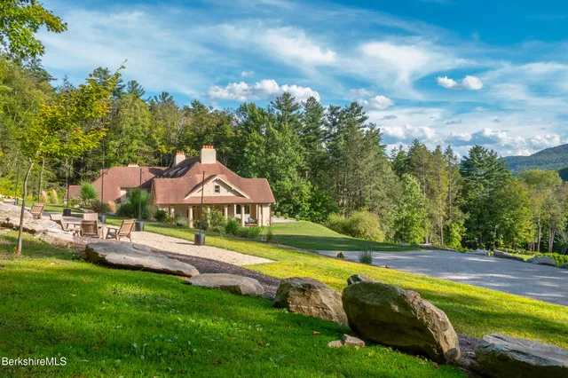 a view of a swimming pool with a yard