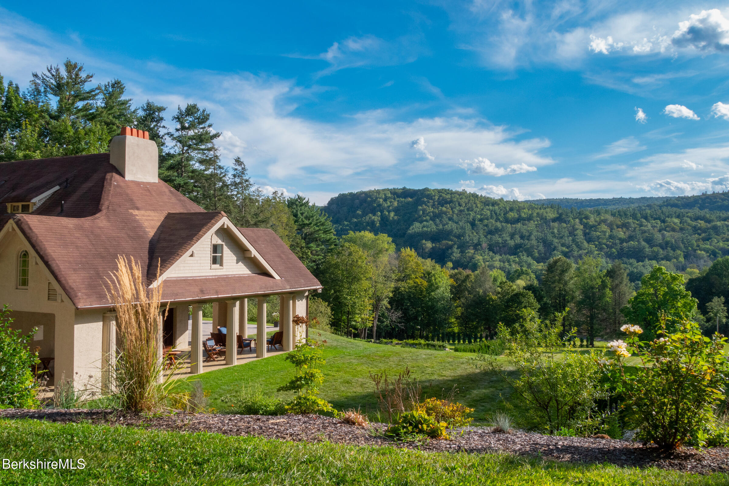 8 Webster Road Tyringham, MA 01264 - Photo 38 of 52 a front view of a house with a yard