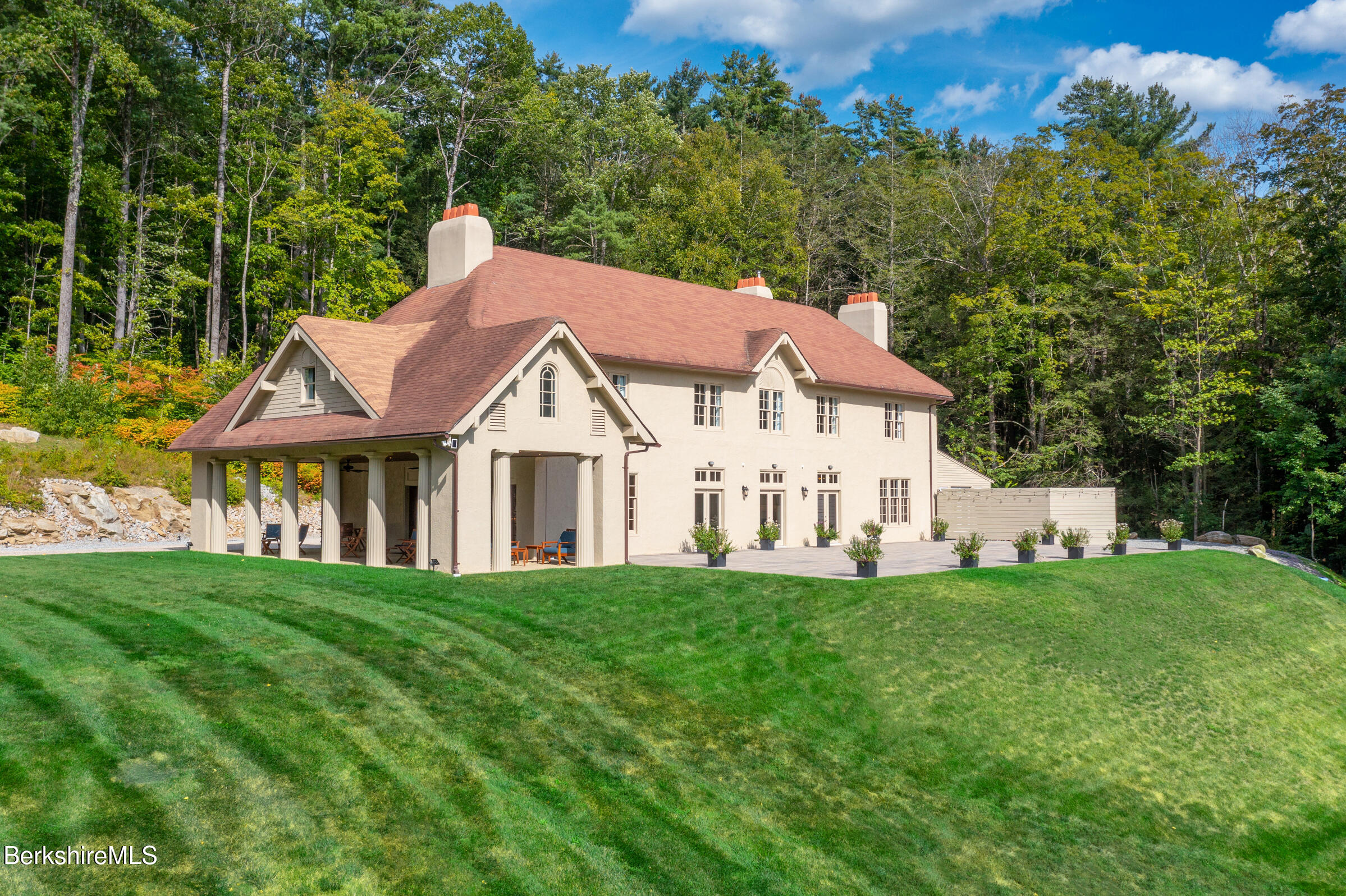 8 Webster Road Tyringham, MA 01264 - Photo 47 of 52 a view of a house with a big yard and large trees