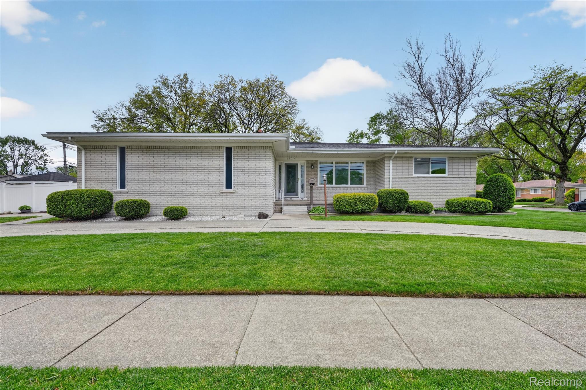 12014 Common Road Warren, MI 48093 - Photo 1 of 30 View of front facade featuring a front lawn and brick siding
