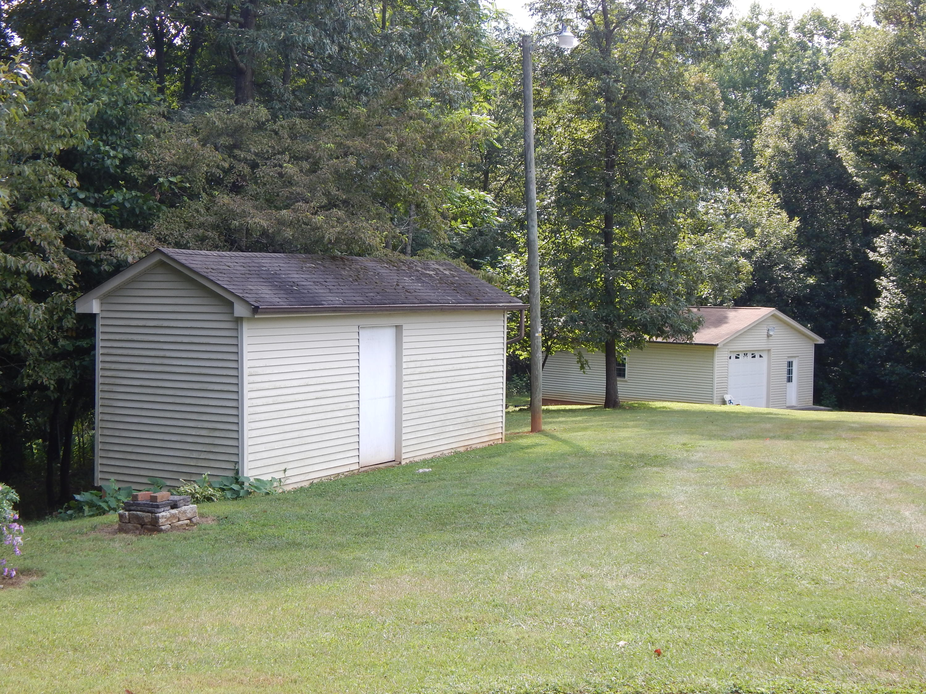 2805 Spradlin Road Vinton, VA 24179 - Photo 19 of 19 a front view of a house with a yard and garage