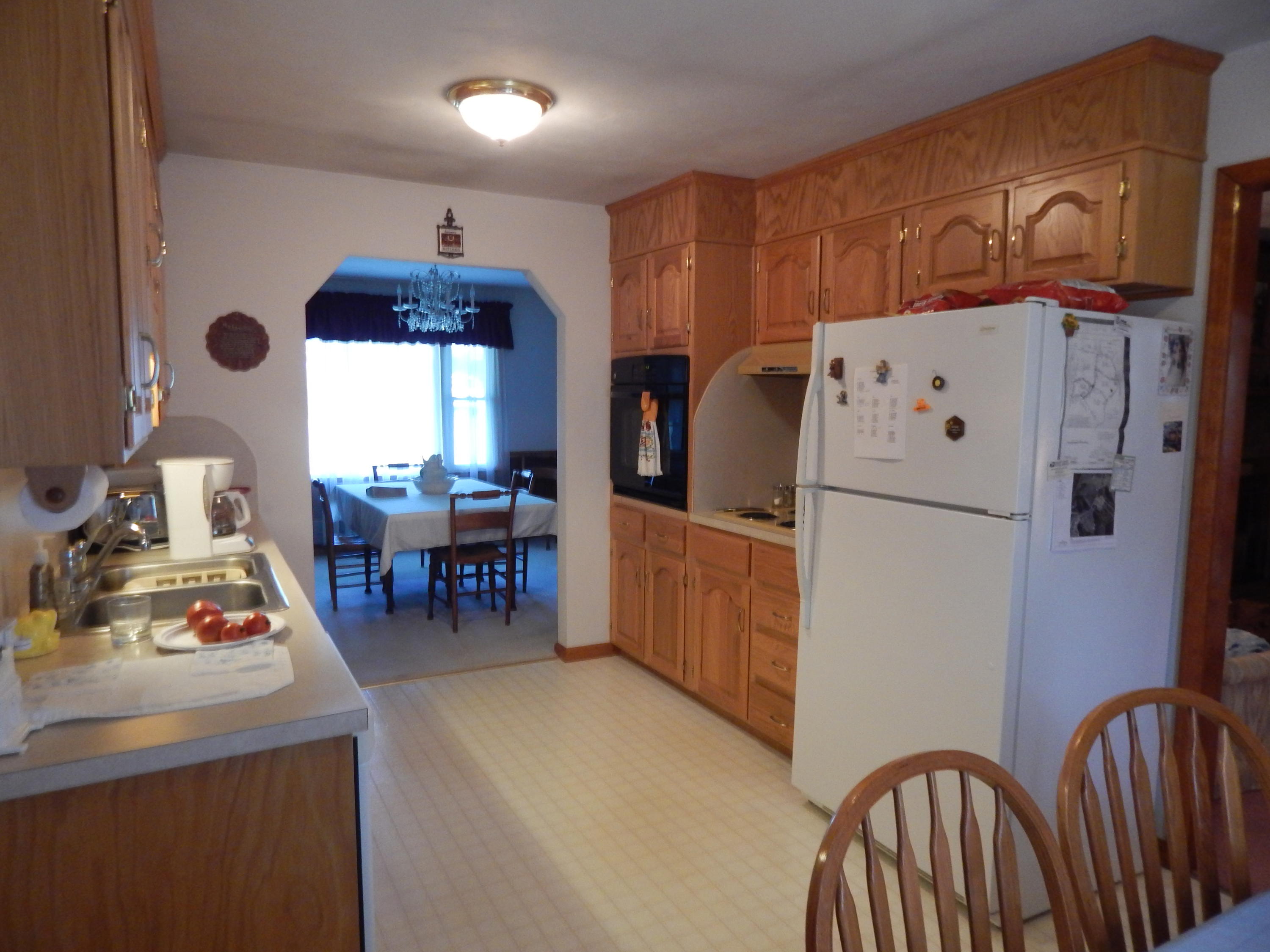 2805 Spradlin Road Vinton, VA 24179 - Photo 7 of 19 a kitchen with stainless steel appliances granite countertop a refrigerator and a dining table with wooden floor