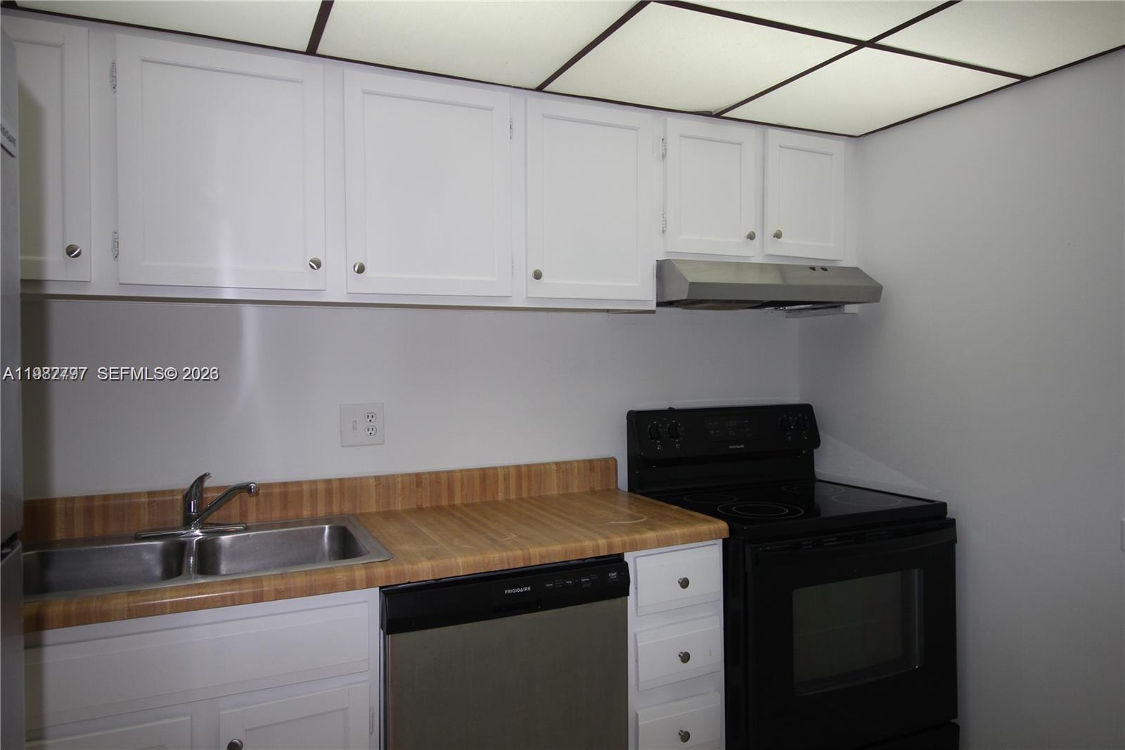 3680 Inverrary Drive, Unit 3D Lauderhill, FL 33319 - Photo 13 of 16 a kitchen with a sink and cabinets