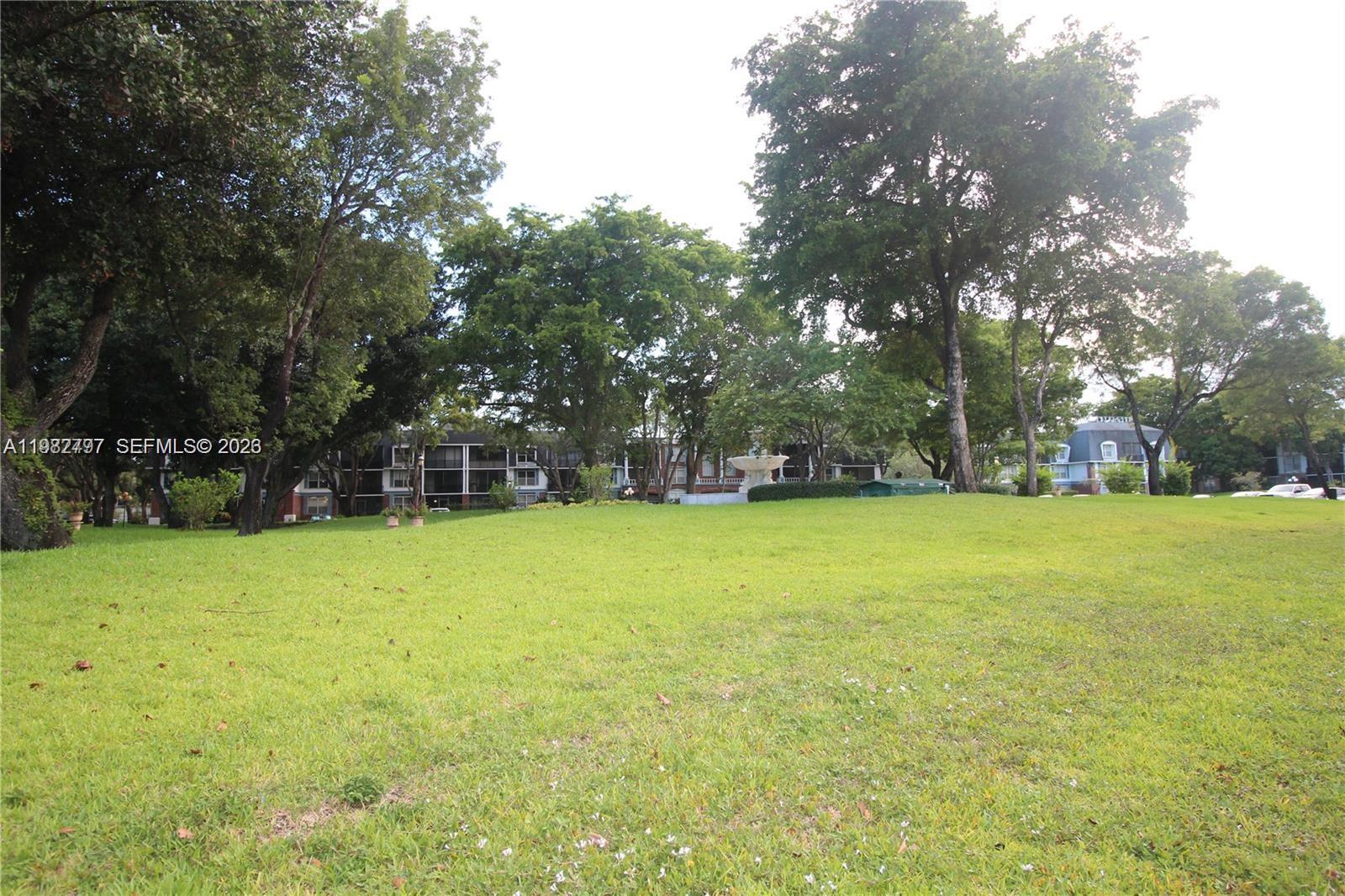 3680 Inverrary Drive, Unit 3D Lauderhill, FL 33319 - Photo 14 of 16 a view of outdoor space with playground and green space