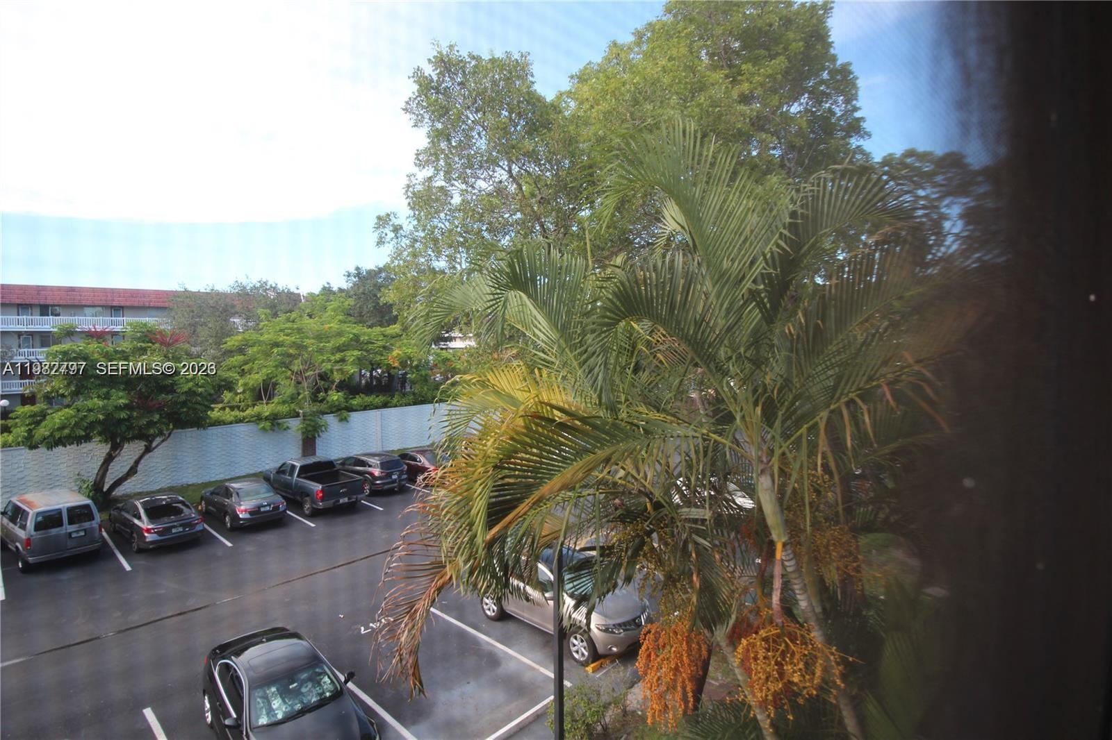 3680 Inverrary Drive, Unit 3D Lauderhill, FL 33319 - Photo 15 of 16 a view of a parking area