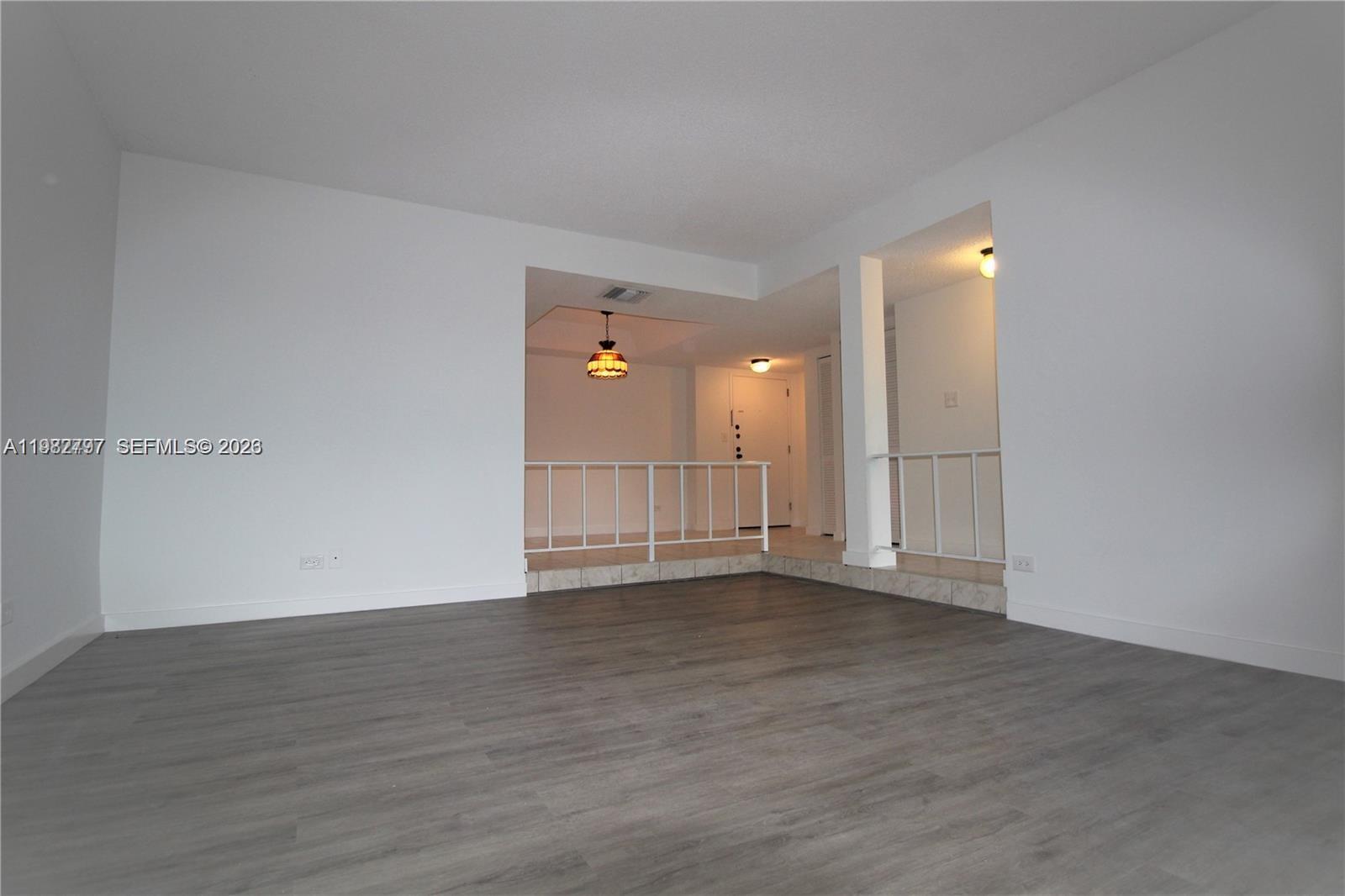 3680 Inverrary Drive, Unit 3D Lauderhill, FL 33319 - Photo 2 of 16 a view of an empty room with wooden floor