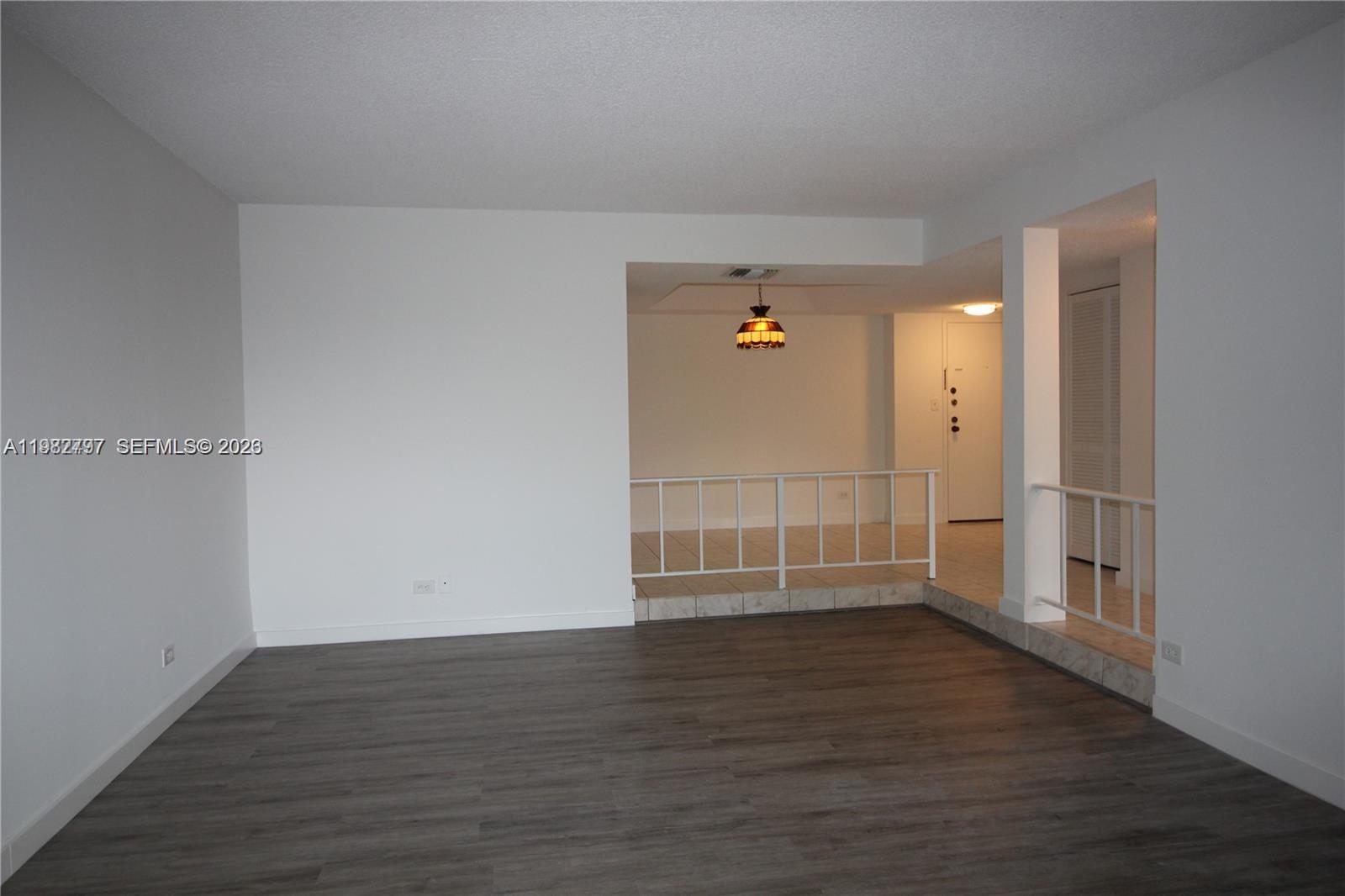 3680 Inverrary Drive, Unit 3D Lauderhill, FL 33319 - Photo 3 of 16 a view of empty room with wooden floor and white walls