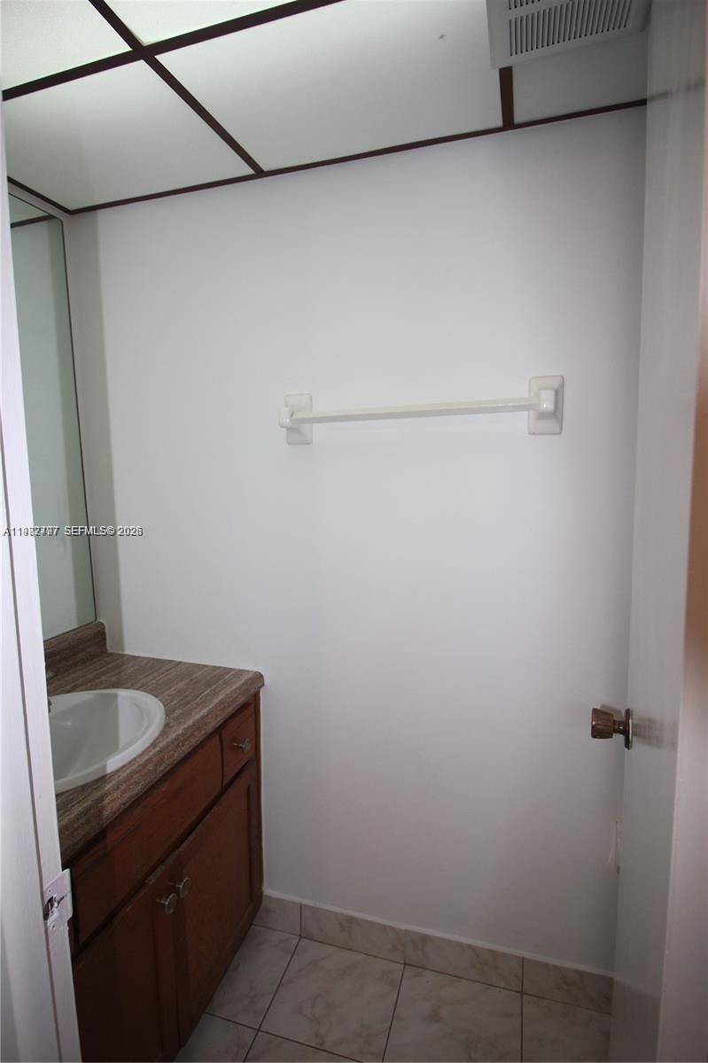 3680 Inverrary Drive, Unit 3D Lauderhill, FL 33319 - Photo 5 of 16 a bathroom with a sink and vanity