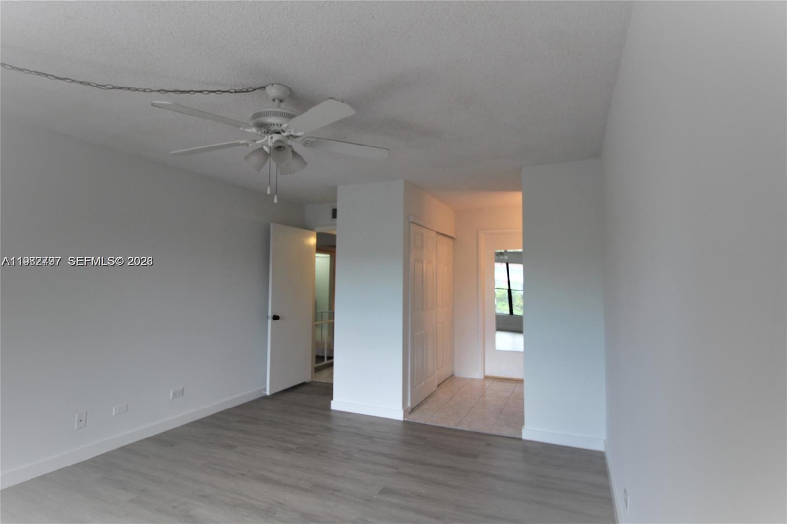 3680 Inverrary Drive, Unit 3D Lauderhill, FL 33319 - Photo 6 of 16 a view of an empty room with a window