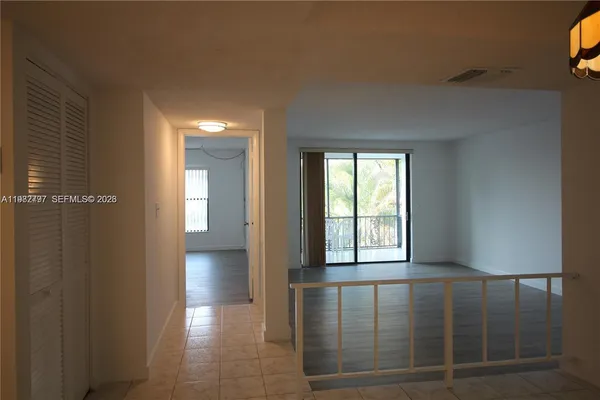 a view of a hallway with windows