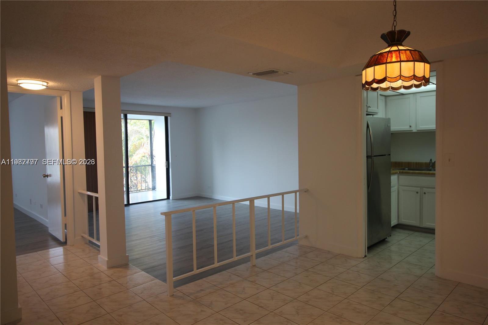 3680 Inverrary Drive, Unit 3D Lauderhill, FL 33319 - Photo 8 of 16 wooden floor in an empty room and a window