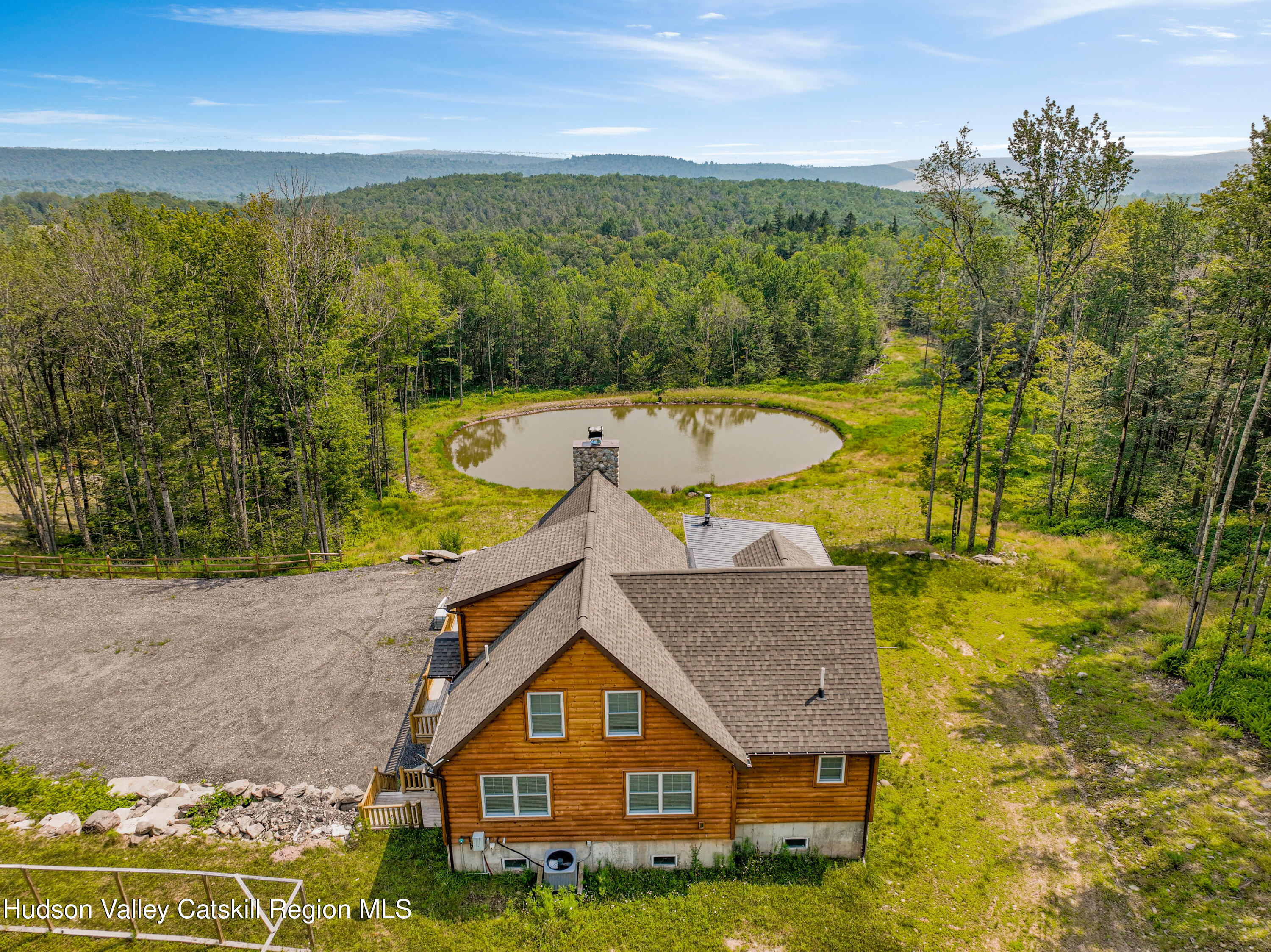 376 Aden Hill Road, Unit NEAR NEVERSINK RESERVOIR Neversink, NY 12768 - Photo 4 of 50 a aerial view of a house with a swimming pool