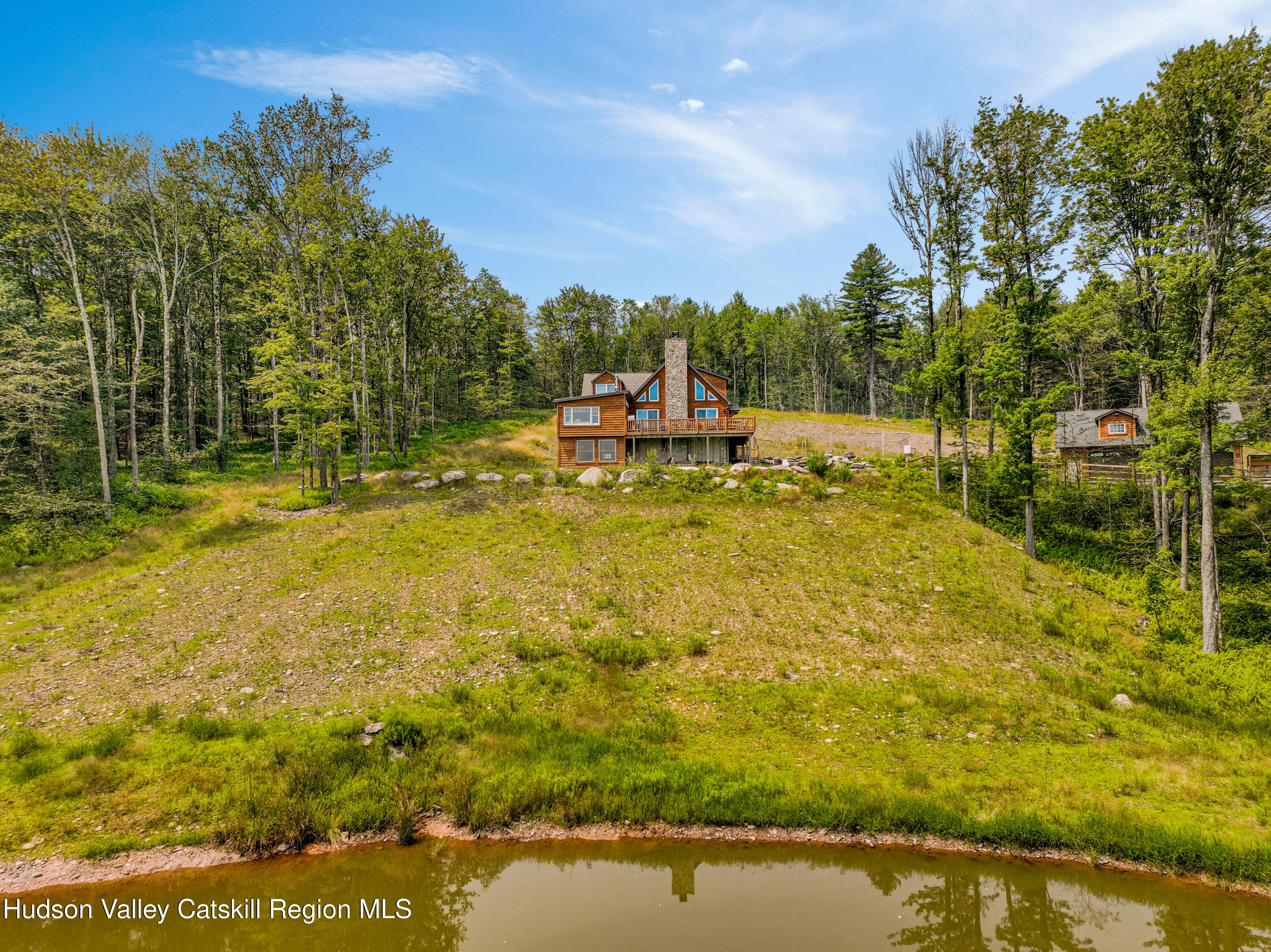 376 Aden Hill Road, Unit NEAR NEVERSINK RESERVOIR Neversink, NY 12768 - Photo 5 of 50 a view of a lake with houses