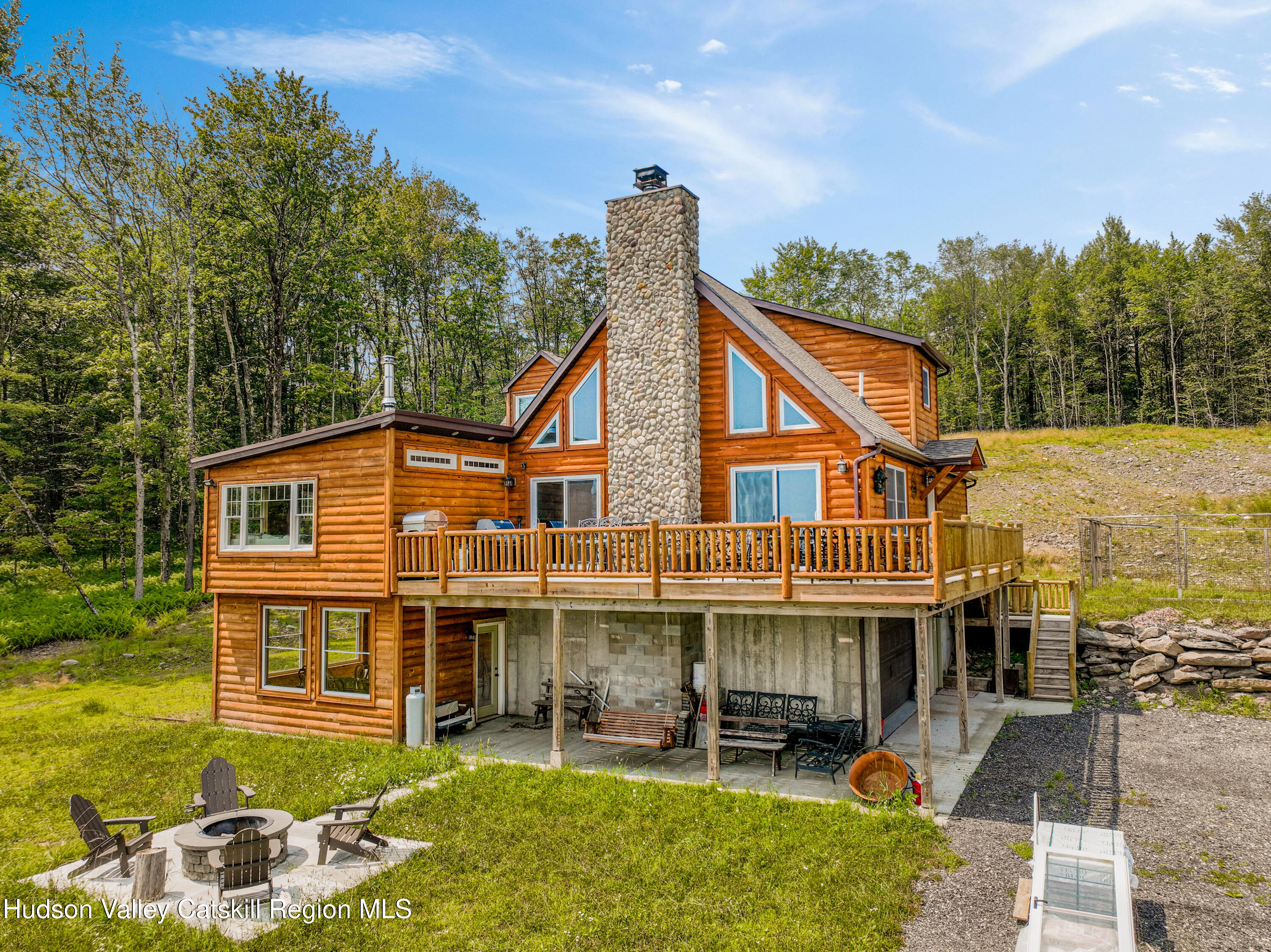 376 Aden Hill Road, Unit NEAR NEVERSINK RESERVOIR Neversink, NY 12768 - Photo 8 of 50 a view of a house with a yard