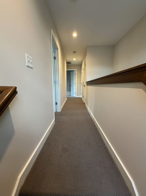 11 Alder Street, Unit 42B Waltham, MA 02453 - Photo 6 of 15 a view of a hallway