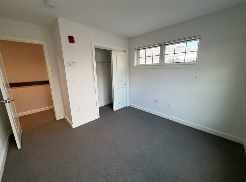 11 Alder Street, Unit 42B Waltham, MA 02453 - Photo 8 of 15 an empty room with windows