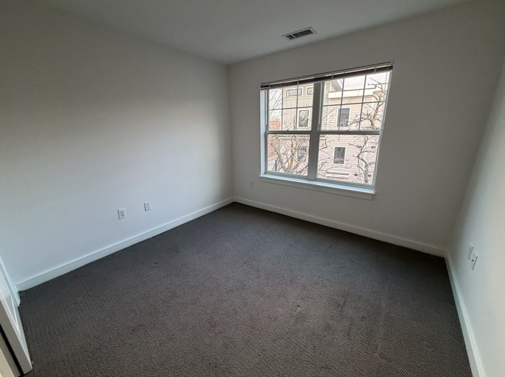 11 Alder Street, Unit 42B Waltham, MA 02453 - Photo 10 of 15 an empty room with a window