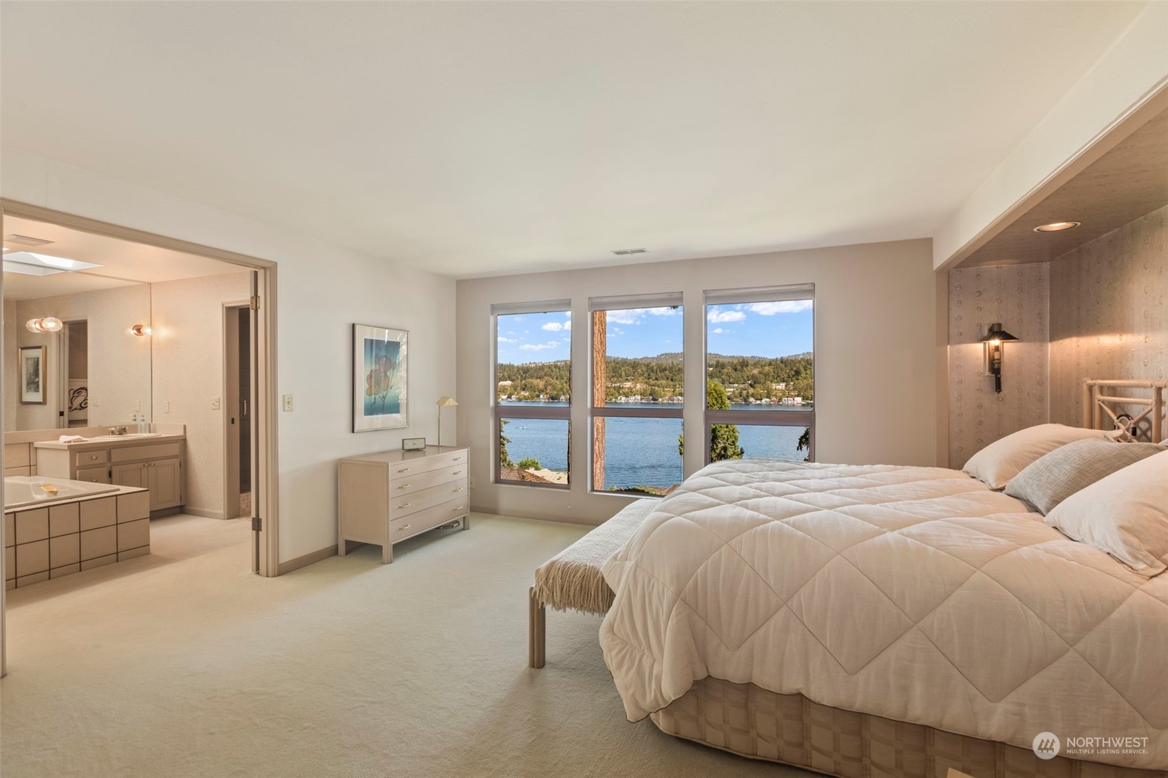 6244 East Mercer Way Mercer Island, WA 98040 - Photo 19 of 40 a spacious bedroom with a bed and large large window