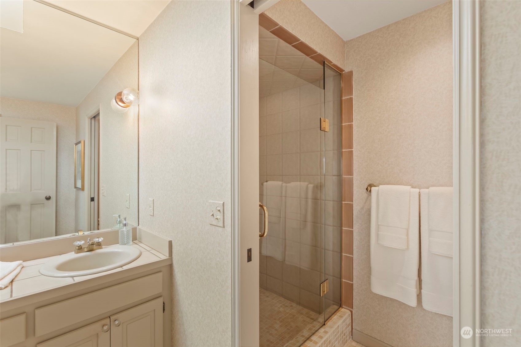 6244 East Mercer Way Mercer Island, WA 98040 - Photo 23 of 40 a bathroom with a sink and mirror