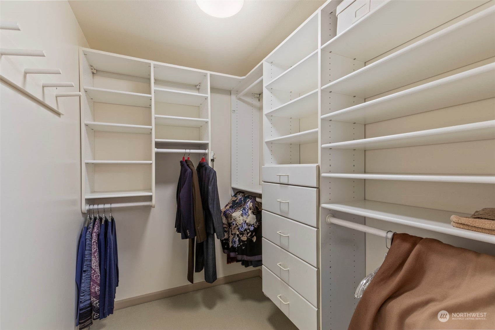 6244 East Mercer Way Mercer Island, WA 98040 - Photo 24 of 40 a view of walk in closet with clothes and shoes