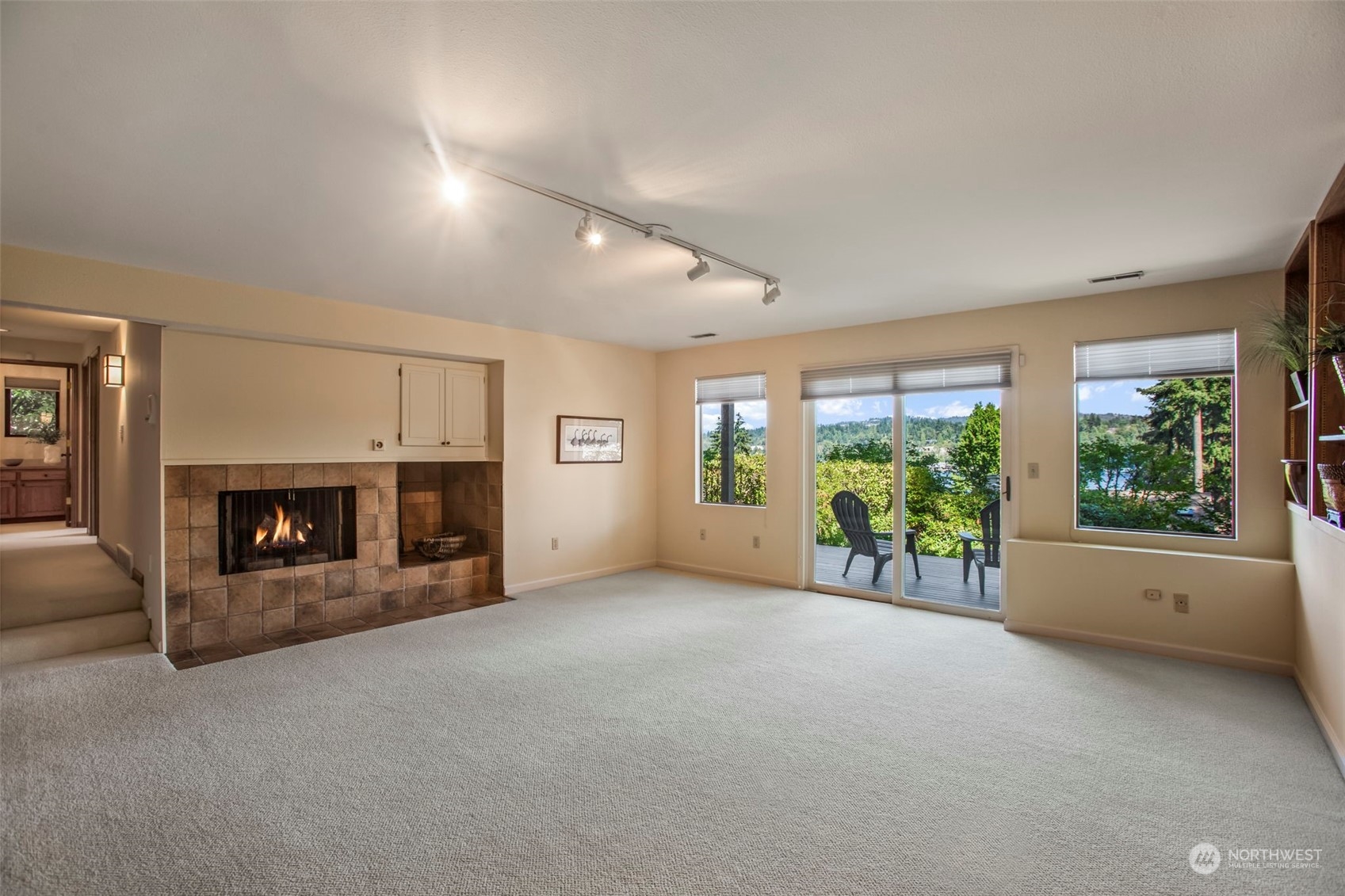 6244 East Mercer Way Mercer Island, WA 98040 - Photo 30 of 40 an empty room with furniture and a fireplace