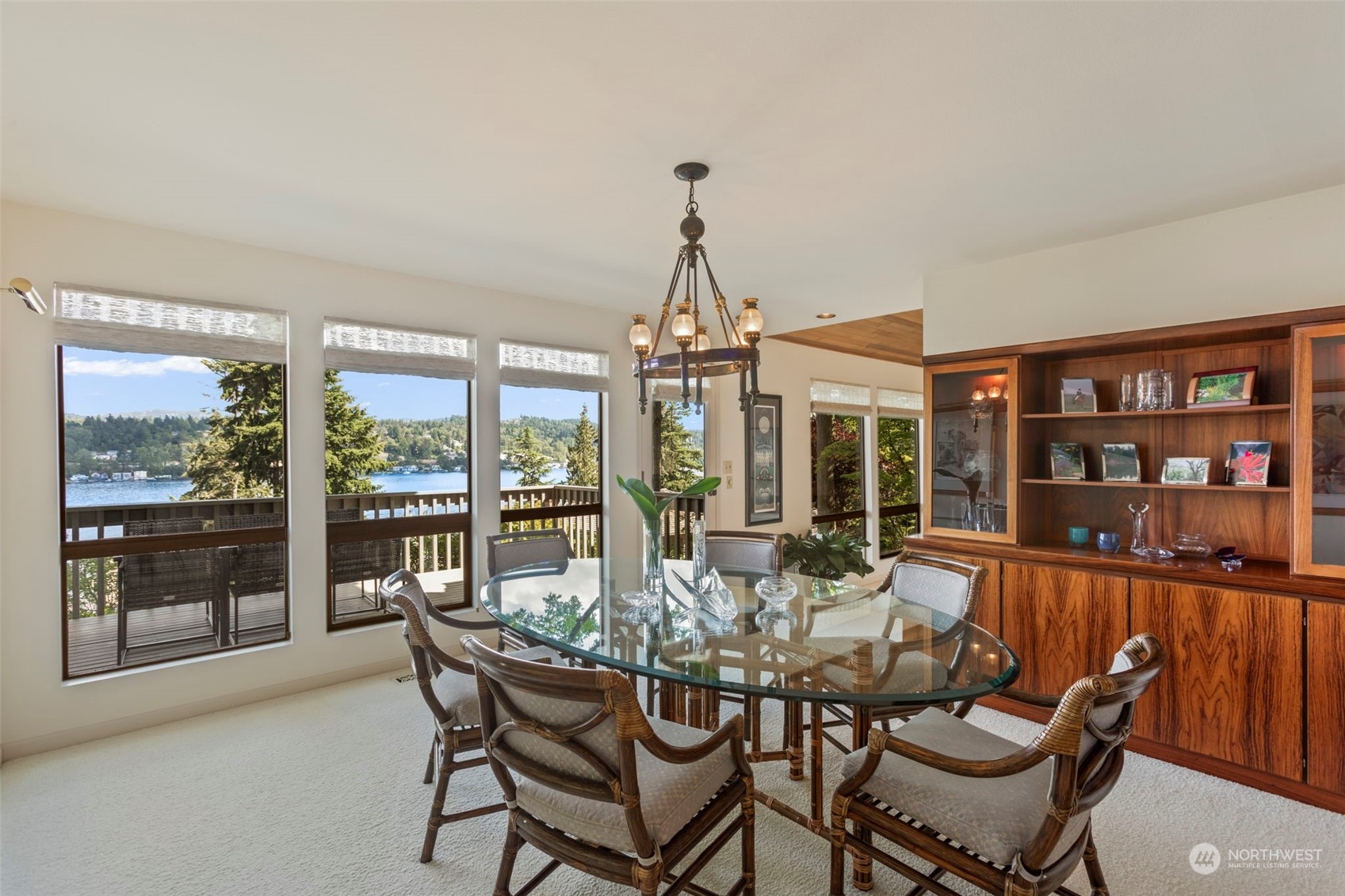 6244 East Mercer Way Mercer Island, WA 98040 - Photo 8 of 40 a dining room with furniture water view and a floor to ceiling window
