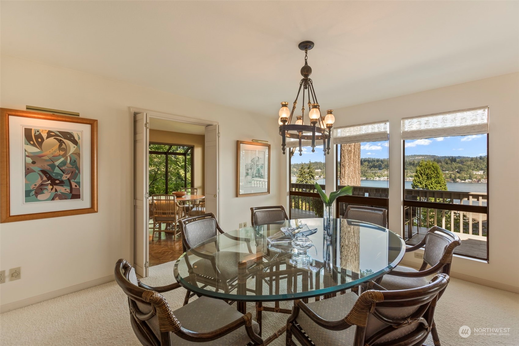 6244 East Mercer Way Mercer Island, WA 98040 - Photo 9 of 40 a dining room with furniture a chandelier and wooden floor