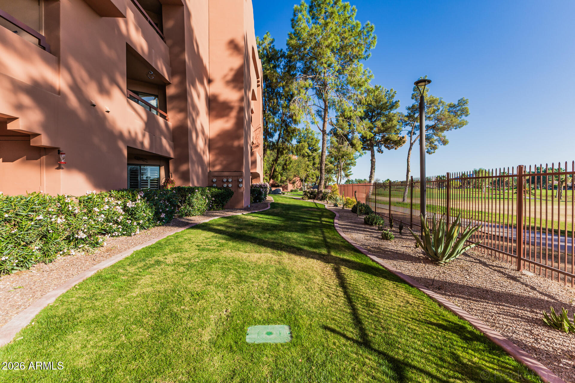 4303 East Cactus Road, Unit 126 Phoenix, AZ 85032 - Photo 2 of 31 a view of a swimming pool with a patio and lake view
