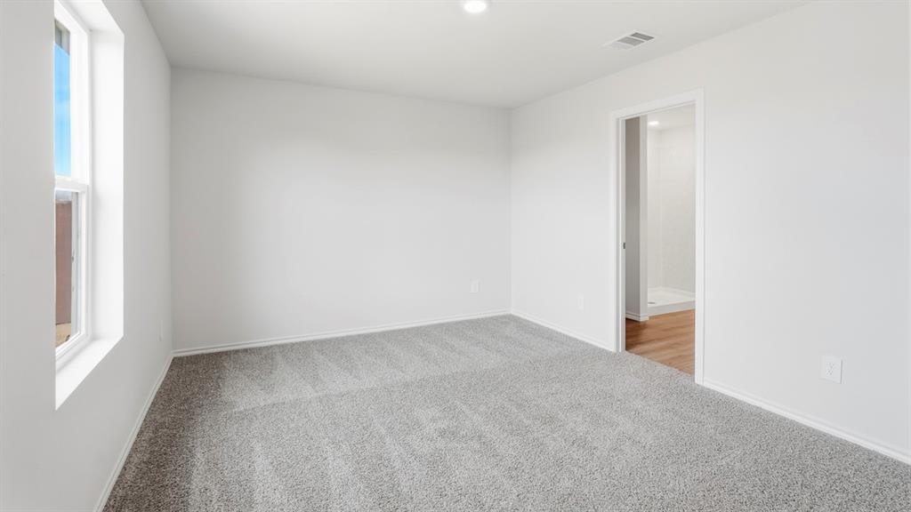 3319 Twilight Trail Forney, TX 75126 - Photo 16 of 33 Interior room featuring light gray carpeting, white walls, and a single window with white trim