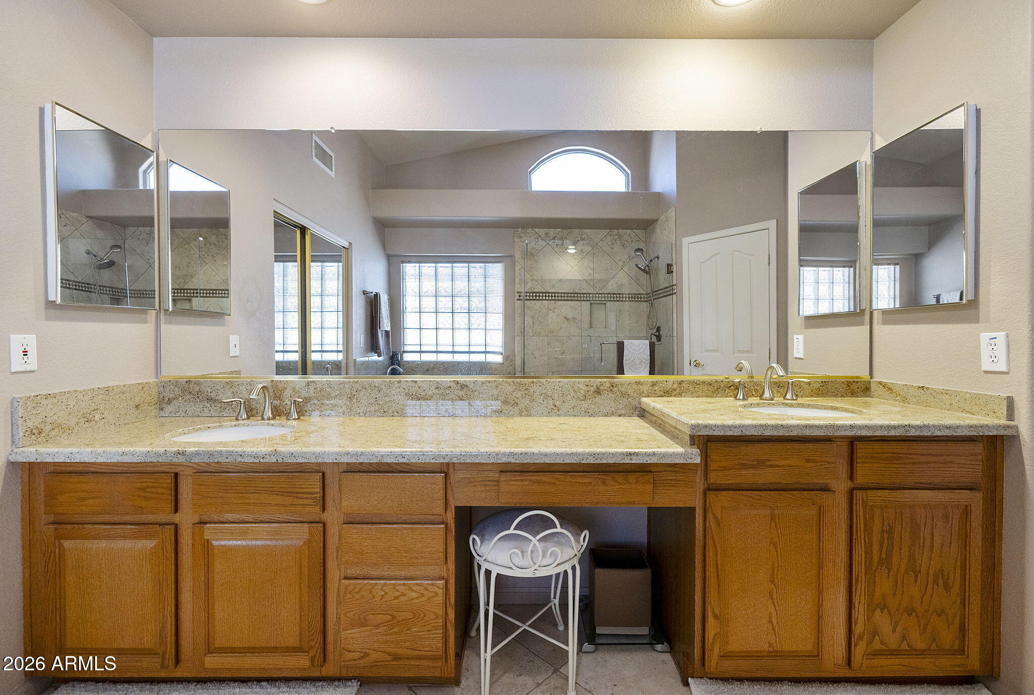12435 West Monte Vista Road Avondale, AZ 85392 - Photo 39 of 69 a bathroom with a granite countertop sink and a mirror