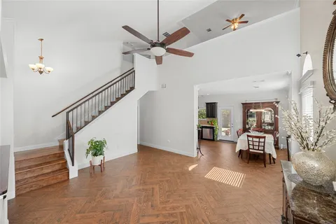 a kitchen with stainless steel appliances granite countertop a refrigerator sink and stove