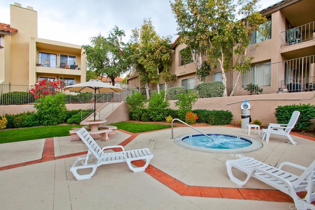 1145 Privet Street San Marcos, CA 92069 - Photo 22 of 24 a view of a patio with table and chairs potted plants and a fire pit