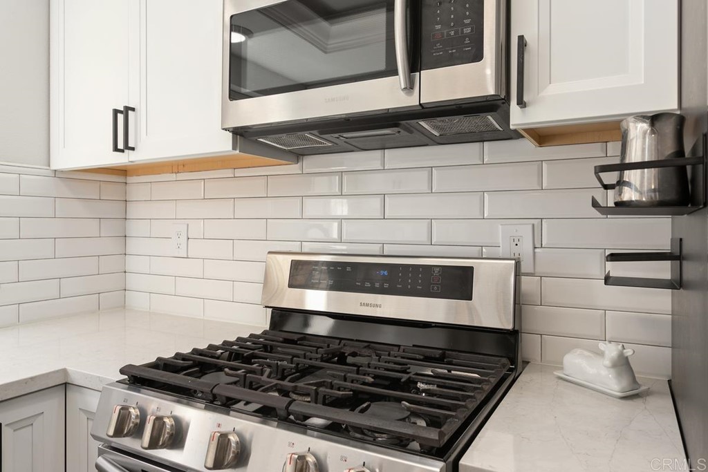 1145 Privet Street San Marcos, CA 92069 - Photo 5 of 24 a stove top oven sitting inside of a kitchen