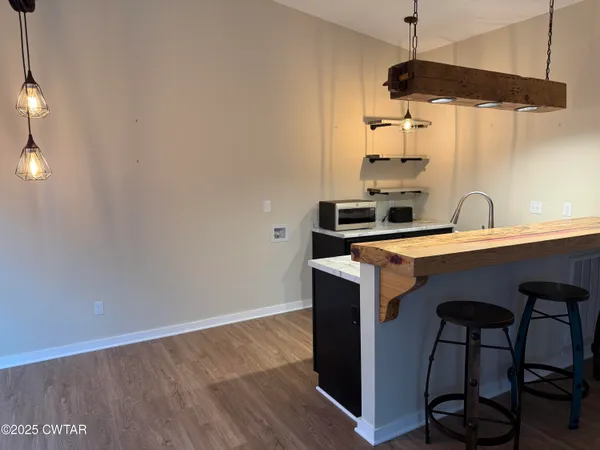 a kitchen with a sink cabinets and appliances