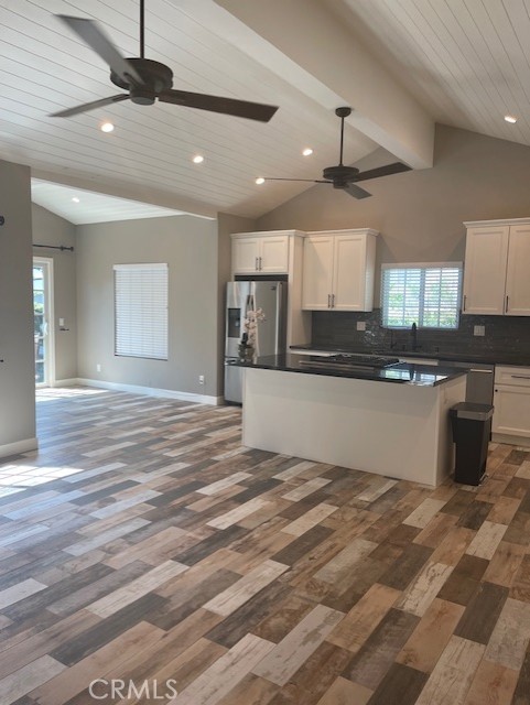 5255 Sylmar Avenue Sherman Oaks, CA 91401 - Photo 3 of 13 a large kitchen with kitchen island a sink stainless steel appliances and cabinets