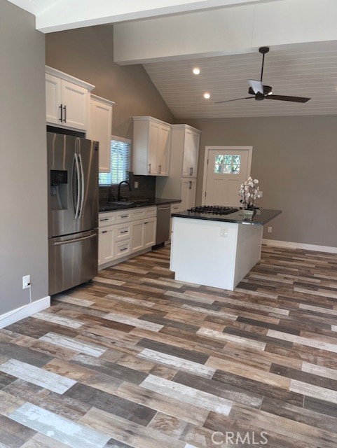 5255 Sylmar Avenue Sherman Oaks, CA 91401 - Photo 8 of 13 a kitchen with stainless steel appliances a refrigerator sink and stove