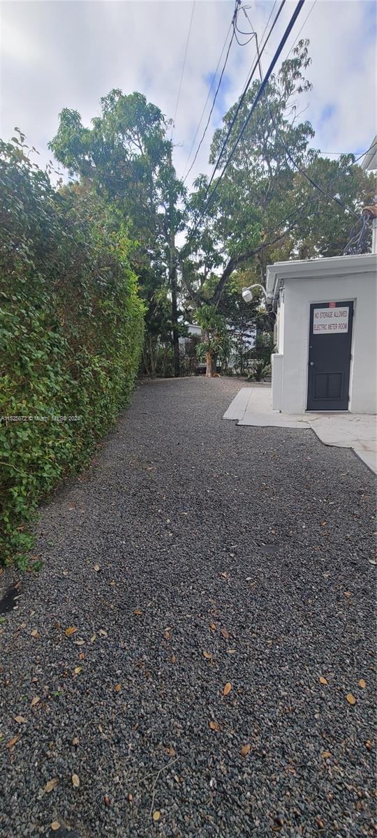 Silver Bluff Miami, FL 33133 - Photo 12 of 12 a view of a house with a yard and garage